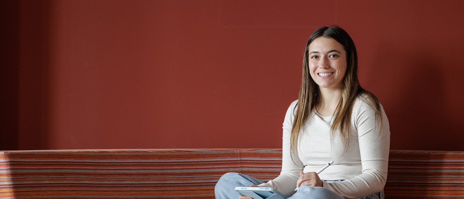 female student studying in lounge