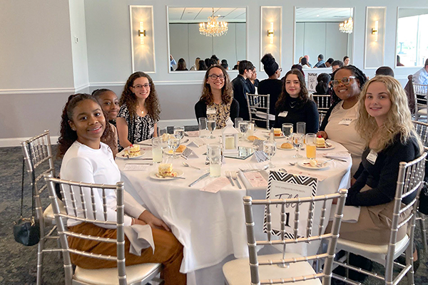 Students at a table attending college event