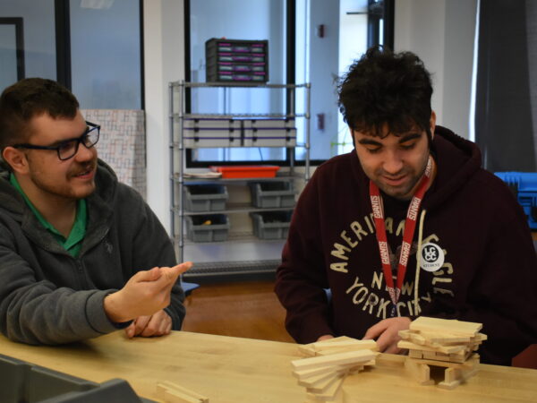 Male students working together at a table