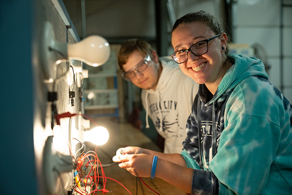 Female and male student working in technology lab