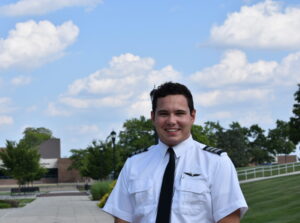 Image shows Nate Steigerwalt smiling on the main campus mall area.
