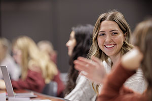 Female student smiling in classroom