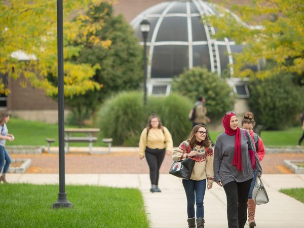 Image shows students walking on the Main Campus mall area.