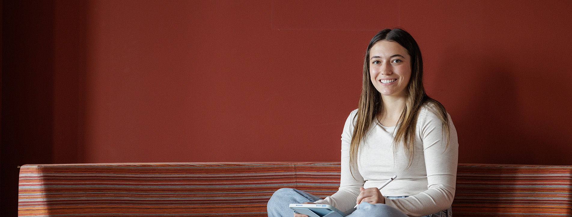 female student studying in lounge